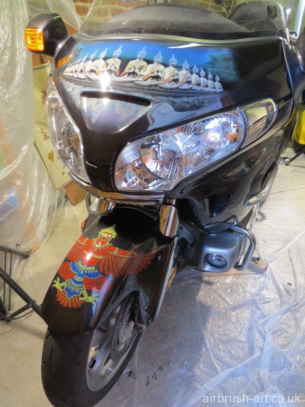 Thai Budda and eagle images airbrushed across the front of the Goldwing.