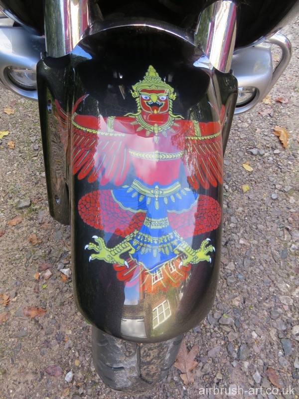 Detailed airbrushing on custom painted motorcycle mudguard.