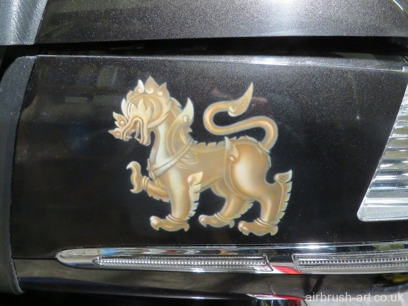 Gold lion on a Goldwing Motorcycle.