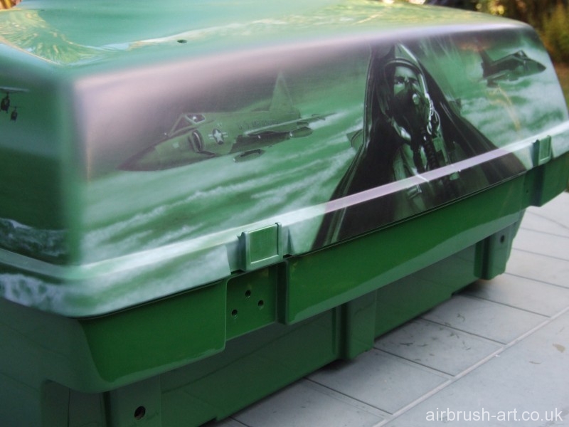 Airbrushed Vietnam war pilot in cockpit with fighter jets either side onto luggage box.